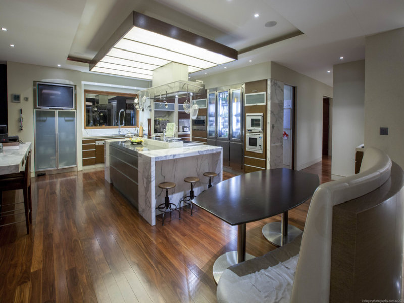 The beautifully well-built designed kitchen contains marble benches.