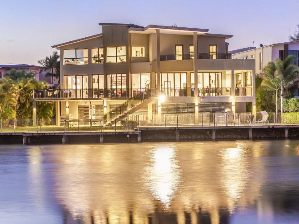 Reflection on the water of a luxury residence in Lakelands