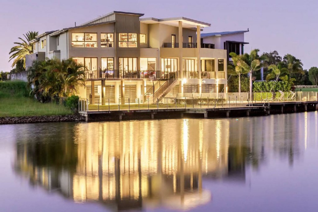 Reflection on the water of a luxury residence in Lakelands Golf Course custom build