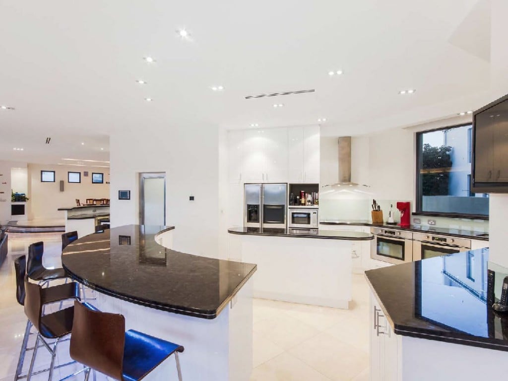 Spacious kitchen with stone benches