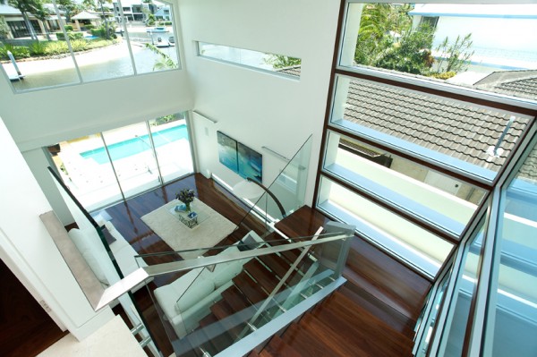 Wooden staircase and wrap around swimming pool